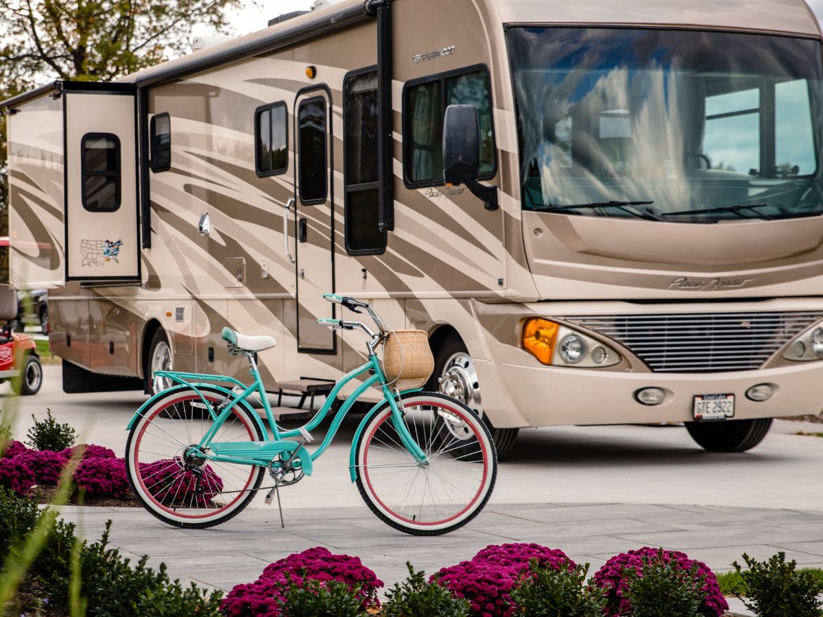 RV parked outside a rental home with a bicycle